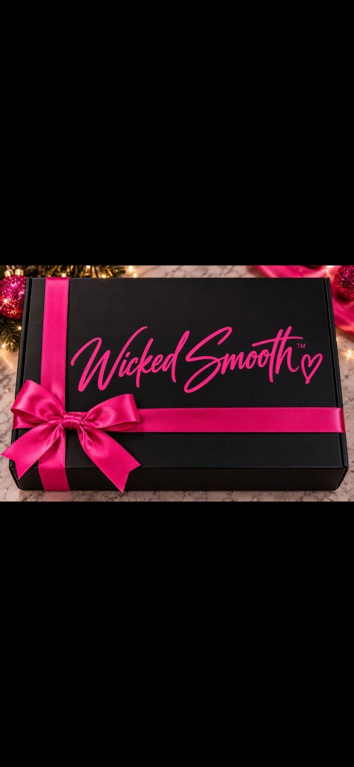 Wicked Smooth limited-edition holiday gift box in black with hot pink ribbon