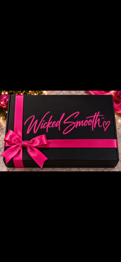 Wicked Smooth limited-edition holiday gift box in black with hot pink ribbon
